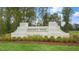 Entrance sign for Madden West community with landscaping and green grass at 802 Dorset Stream Dr, Fuquay Varina, NC 27526