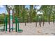 Outdoor fitness area with various exercise stations and wood chip ground covering at 802 Dorset Stream Dr, Fuquay Varina, NC 27526