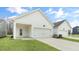 Charming home with a two-car garage, well-manicured lawn, and modern architecture at 802 Dorset Stream Dr, Fuquay Varina, NC 27526