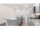 Kitchen with stainless steel appliances, white cabinets, and a granite island at 802 Dorset Stream Dr, Fuquay Varina, NC 27526