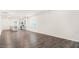 Open-concept living room with wood-look floors and seamless flow to the kitchen at 802 Dorset Stream Dr, Fuquay Varina, NC 27526