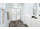 Bright bathroom with a modern glass-enclosed shower, white cabinets, and sleek countertops at 331 Tormore Dr, Sanford, NC 27330