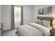 Serene bedroom featuring soft colors, neutral bedding, and natural light from a large window at 331 Tormore Dr, Sanford, NC 27330