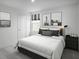 Stylish bedroom with modern decor, dark accents, comfortable bedding, and lots of light from a window at 331 Tormore Dr, Sanford, NC 27330