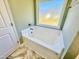 Corner bathtub with window view at 144 Emerson Fields Dr, Pikeville, NC 27863