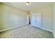 Spacious bedroom with neutral carpet, light walls, and a closet at 144 Emerson Fields Dr, Pikeville, NC 27863