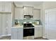 Kitchen featuring stainless steel appliances, stylish backsplash, and light gray cabinets at 144 Emerson Fields Dr, Pikeville, NC 27863