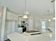 Modern kitchen boasts a breakfast bar with pendant lights, modern cabinets, and stainless steel appliances at 144 Emerson Fields Dr, Pikeville, NC 27863