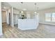 Modern kitchen boasts a breakfast bar with pendant lights and modern cabinets, and stainless steel appliances at 144 Emerson Fields Dr, Pikeville, NC 27863
