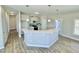 Modern kitchen boasts a breakfast bar with pendant lights and modern cabinets, and stainless steel appliances at 144 Emerson Fields Dr, Pikeville, NC 27863