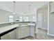 Kitchen featuring a counter-height bar overlooking the living room and fireplace at 144 Emerson Fields Dr, Pikeville, NC 27863