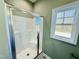 New shower with glass door and window at 144 Emerson Fields Dr, Pikeville, NC 27863