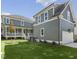 Well-maintained backyard with green lawn and view of the home's exterior at 210 Colvard Farms Rd, Durham, NC 27713
