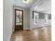 Foyer with a wood door and hardwood floors leading to other parts of the home at 210 Colvard Farms Rd, Durham, NC 27713