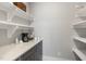 Pantry featuring a stone countertop, cabinets and white shelving at 210 Colvard Farms Rd, Durham, NC 27713