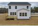 Exterior of new construction home featuring a back deck and backyard at 439 Duncan Creek Rd # 140, Lillington, NC 27546