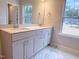 Bathroom features a double sink vanity with modern fixtures and a view of the backyard at 439 Duncan Creek Rd # 140, Lillington, NC 27546