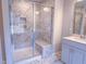 Modern bathroom showcasing a glass-enclosed shower with marble tile and built-in bench at 439 Duncan Creek Rd # 140, Lillington, NC 27546
