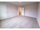 Spacious bedroom showcasing carpeted flooring and a view of the hallway through the opening door at 439 Duncan Creek Rd # 140, Lillington, NC 27546