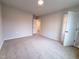 Spacious bedroom with neutral walls, carpet flooring and an open doorway leading to the house at 439 Duncan Creek Rd # 140, Lillington, NC 27546