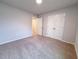 Neutral bedroom offers carpeting, double door closet and a connecting passage to other rooms at 439 Duncan Creek Rd # 140, Lillington, NC 27546