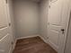 Walk-in closet with wooden floor and a neutral color scheme at 439 Duncan Creek Rd # 140, Lillington, NC 27546