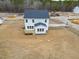 Aerial view of a new construction home featuring a back deck and backyard at 439 Duncan Creek Rd # 140, Lillington, NC 27546
