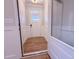 Bright foyer features wood-look flooring, wainscoting, and natural light from the front door at 439 Duncan Creek Rd # 140, Lillington, NC 27546