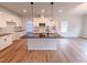 Beautiful kitchen featuring white cabinets, a spacious island, and modern pendant lighting at 439 Duncan Creek Rd # 140, Lillington, NC 27546