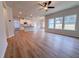 Open-concept living area featuring a kitchen, wood-look flooring and lots of natural light at 439 Duncan Creek Rd # 140, Lillington, NC 27546