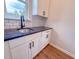 Mudroom with sink, cabinets, and granite counters featuring a stylish black faucet at 439 Duncan Creek Rd # 140, Lillington, NC 27546