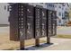 Community mailboxes with individual slots for each unit and package drop box at 6408 Tanner Oak Ln, Raleigh, NC 27613