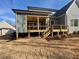 New home with a spacious deck and screened porch, perfect for outdoor living at 1045 Cabin Creek, Pittsboro, NC 27312