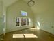 Sunlit bedroom with hardwood floors and large windows at 1045 Cabin Creek, Pittsboro, NC 27312