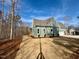 Home's exterior view showcasing a large backyard and trees at 1045 Cabin Creek, Pittsboro, NC 27312