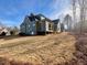 New construction home exterior showcasing expansive backyard at 1045 Cabin Creek, Pittsboro, NC 27312