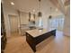 Open kitchen with large island and high-end appliances at 1045 Cabin Creek, Pittsboro, NC 27312