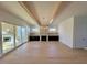 Open living room with stone fireplace and access to deck at 1045 Cabin Creek, Pittsboro, NC 27312