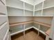 Bright white pantry with ample shelving and wood countertops at 1045 Cabin Creek, Pittsboro, NC 27312