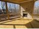 Relaxing screened porch with stone fireplace; enjoy wooded views at 1045 Cabin Creek, Pittsboro, NC 27312
