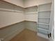 Large walk-in closet with shelving and hanging rods at 1045 Cabin Creek, Pittsboro, NC 27312