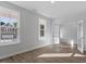 Bedroom with natural light streaming through multiple windows and hardwood floors at 130 Bold Dr, Youngsville, NC 27596