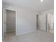 Spacious bedroom with neutral walls, carpet flooring, and walk-in closet, offering comfort and ample storage at 130 Bold Dr, Youngsville, NC 27596