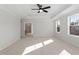 Bright primary bedroom with natural light streaming through multiple windows and trey ceilings at 130 Bold Dr, Youngsville, NC 27596