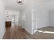 Hallway entrance to open-plan living and hardwood flooring throughout the home at 130 Bold Dr, Youngsville, NC 27596