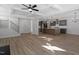 Spacious living room with hardwood floors and an open concept layout into the kitchen at 130 Bold Dr, Youngsville, NC 27596