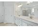 Bathroom featuring double sink vanity, large mirror, and walk-in shower at 413 Edison Rail Ln, Knightdale, NC 27545