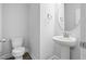 Bathroom featuring a toilet and pedestal sink at 413 Edison Rail Ln, Knightdale, NC 27545