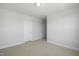 Bedroom featuring neutral carpet, white trim, grey walls, and a closet at 413 Edison Rail Ln, Knightdale, NC 27545