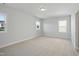 Bedroom with carpet, three windows, and great natural light at 413 Edison Rail Ln, Knightdale, NC 27545